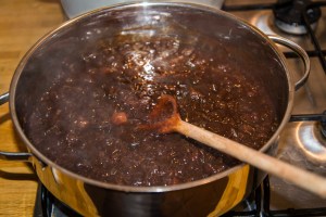 Cooking spicy plum chutney.